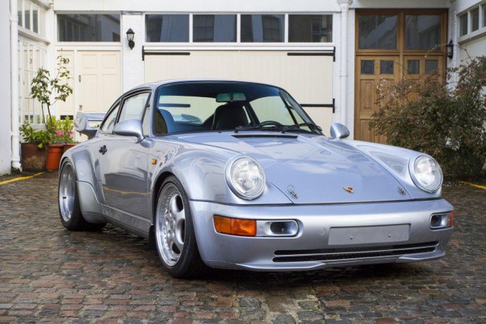 Silver Porsche 911 964 parked on a cobbled mews